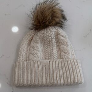 The North Face Cream Knit Hat with Brown Pom-Pom